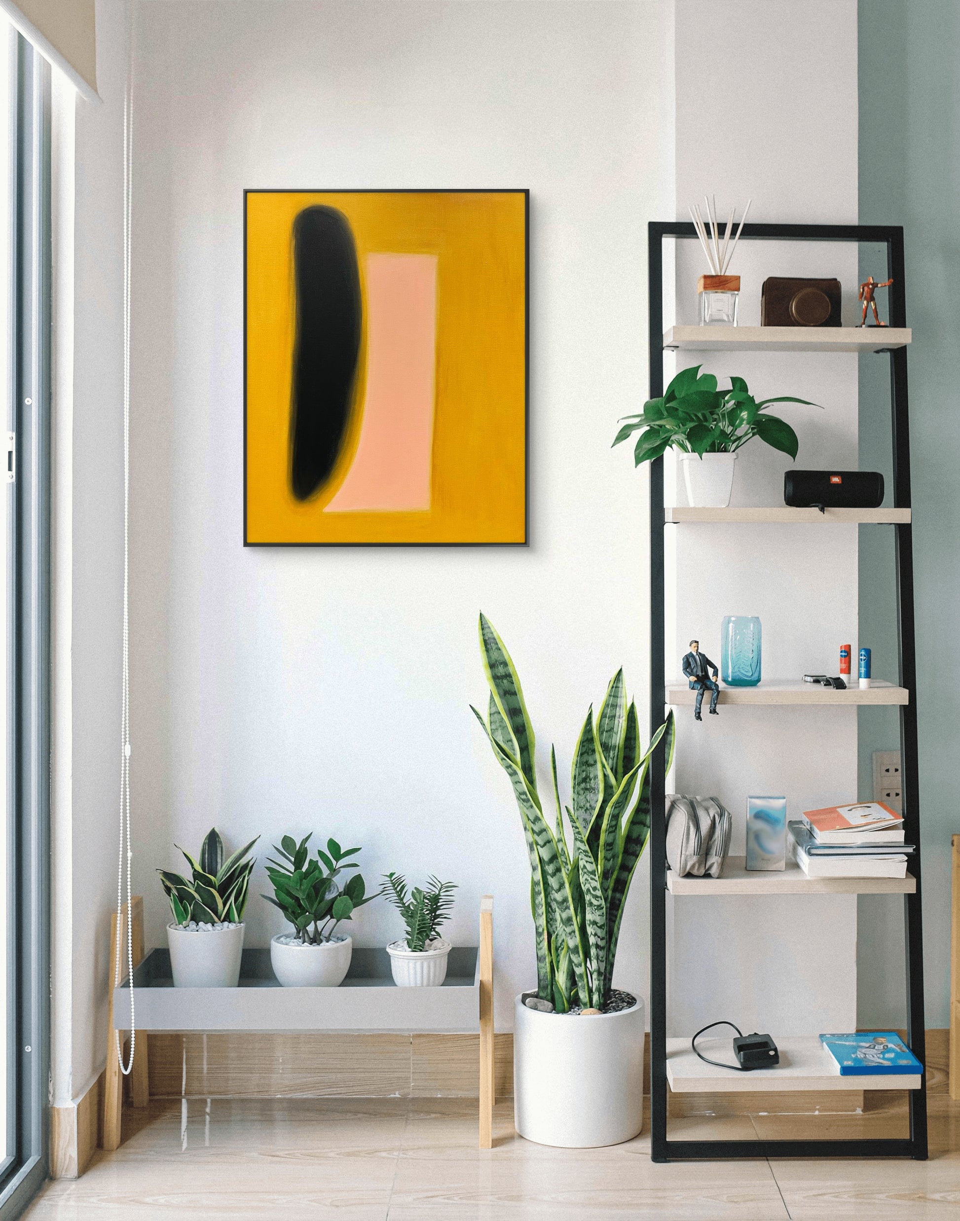 Modern interior with a shelf, plants, and abstract art on a white wall.