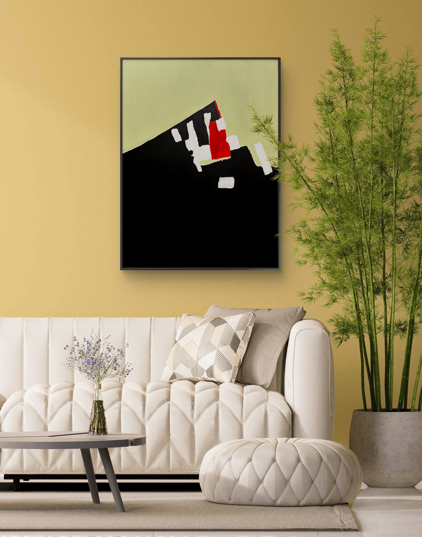 Modern living room with a white sofa, abstract art on the wall, and a plant.