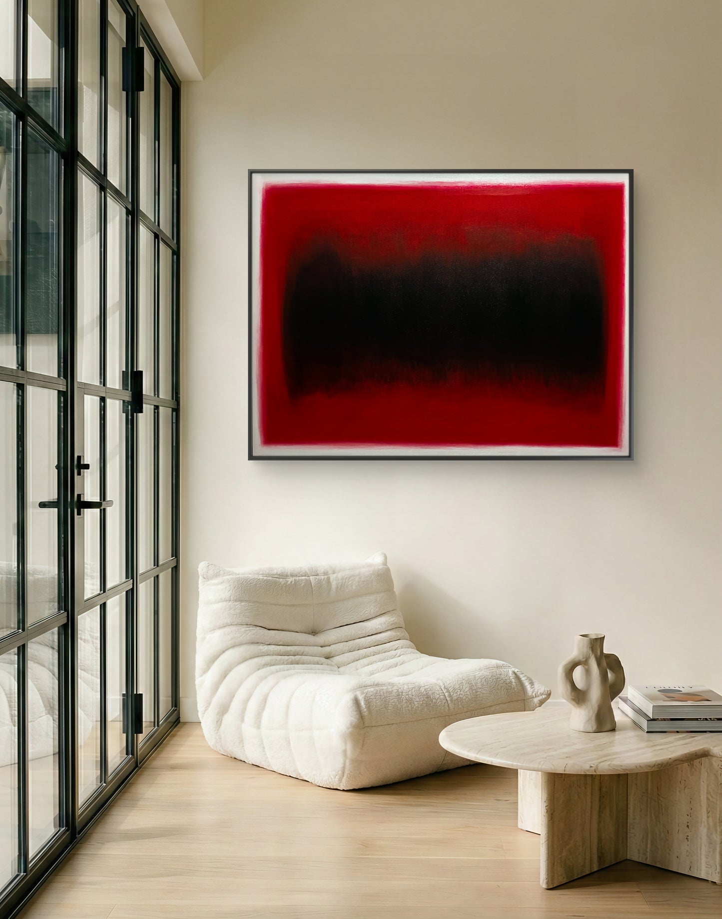 Modern living room with a white armchair, wooden coffee table, and abstract red and black painting on the wall.
