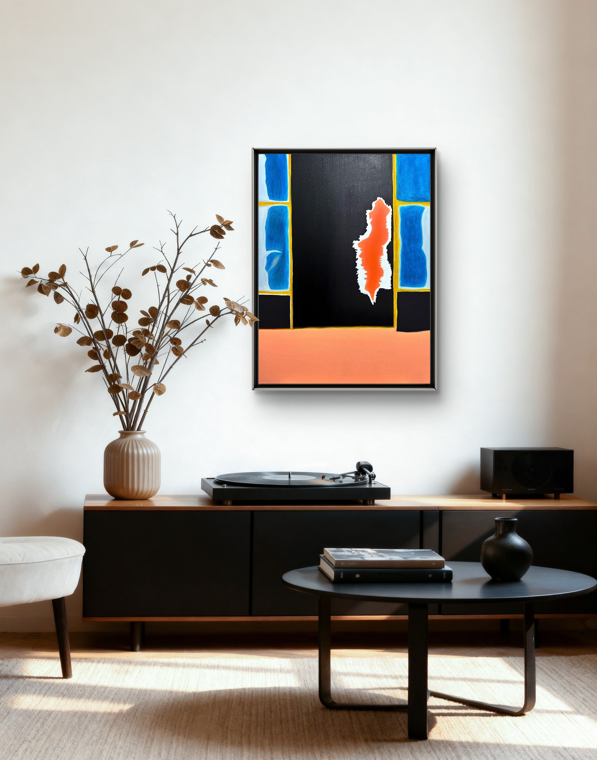 Modern living room with abstract art, turntable, and decorative items.