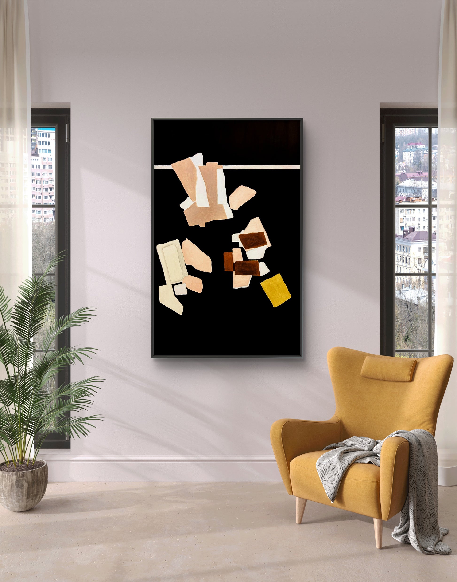 Abstract art piece on a wall above a yellow armchair with a plant to the left.