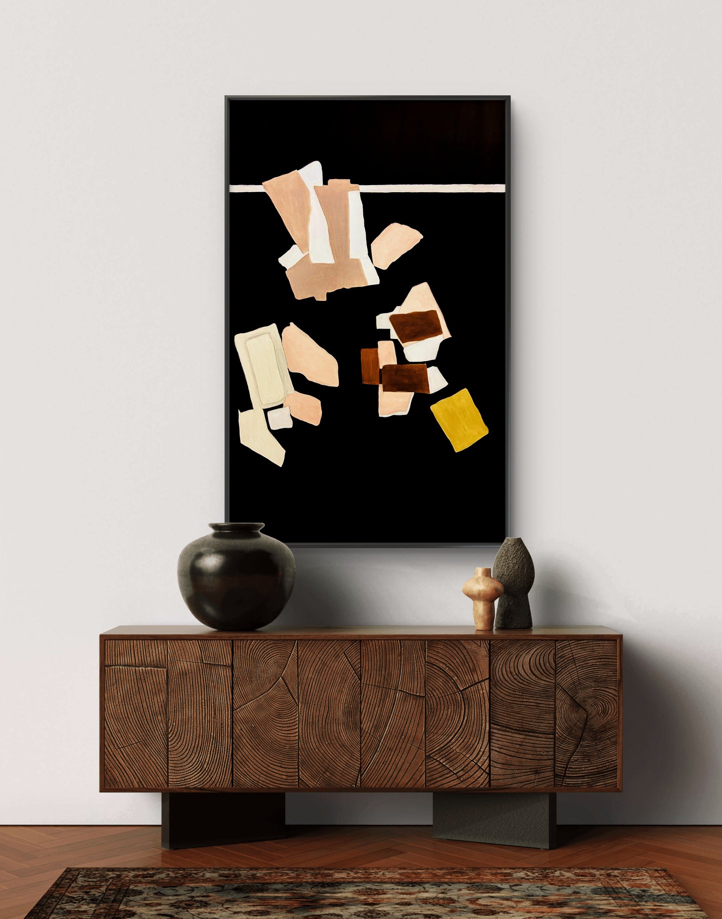 Abstract art piece on a wall above a wooden console table.