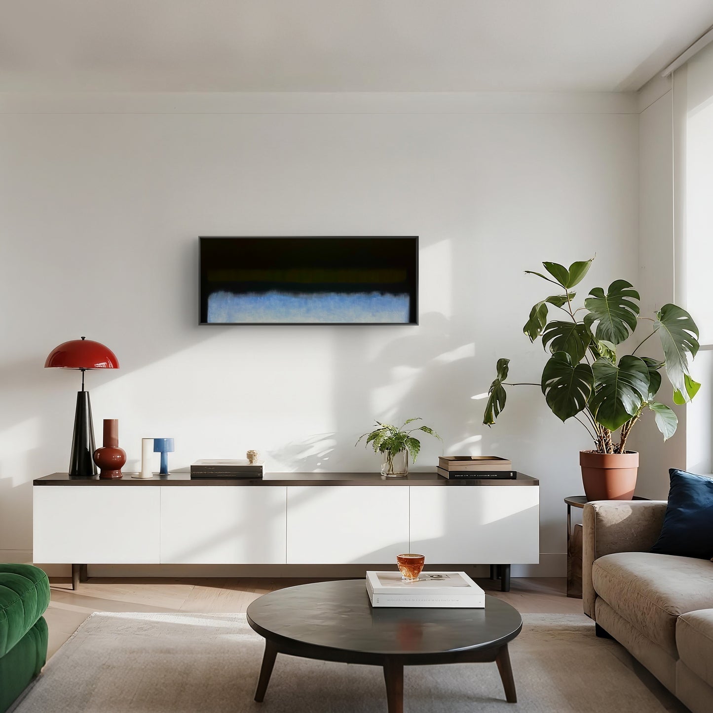 Modern living room with a white console table, round coffee table, and decorative items.