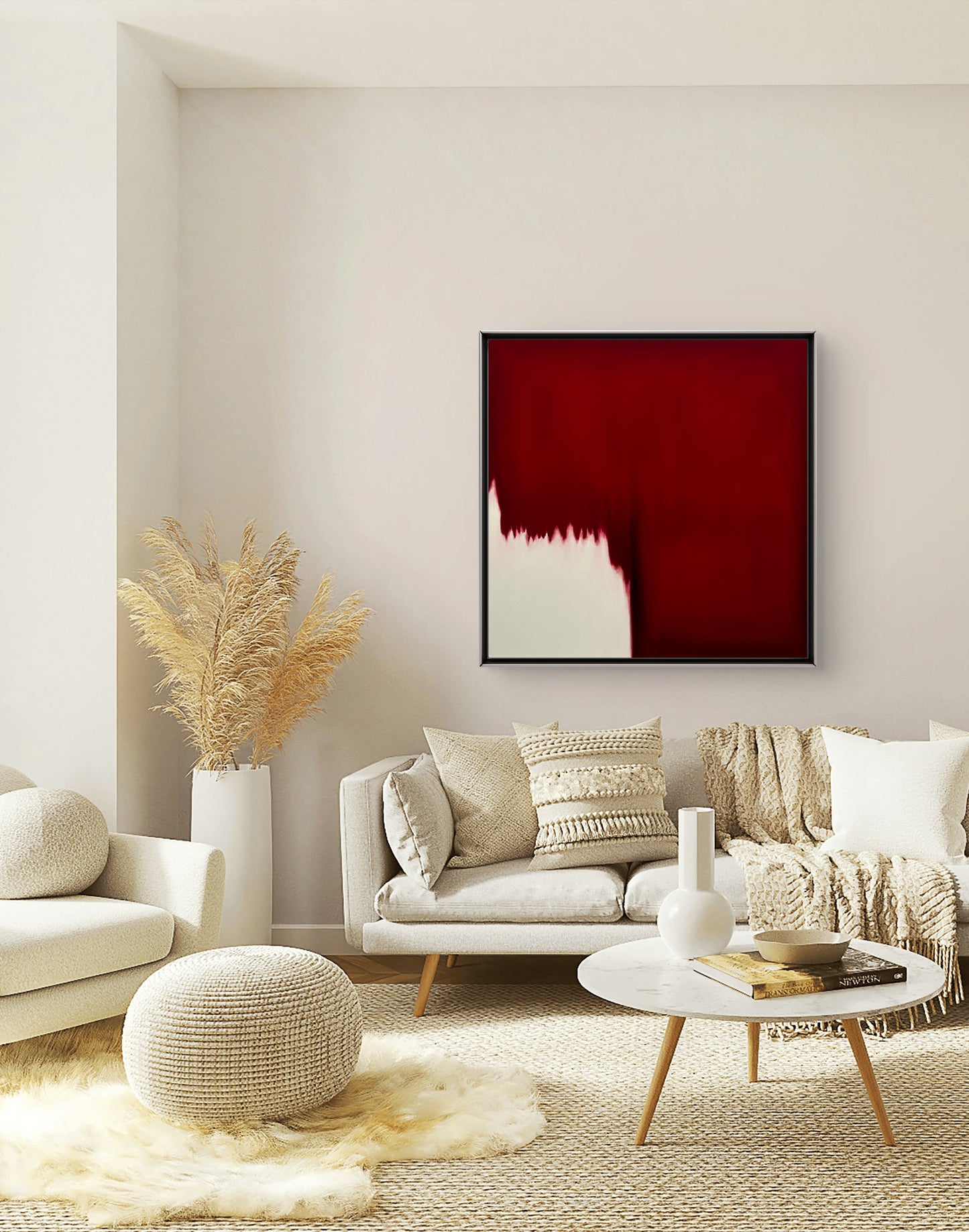 Modern living room with a red abstract painting on the wall, white sofa, and decorative items.