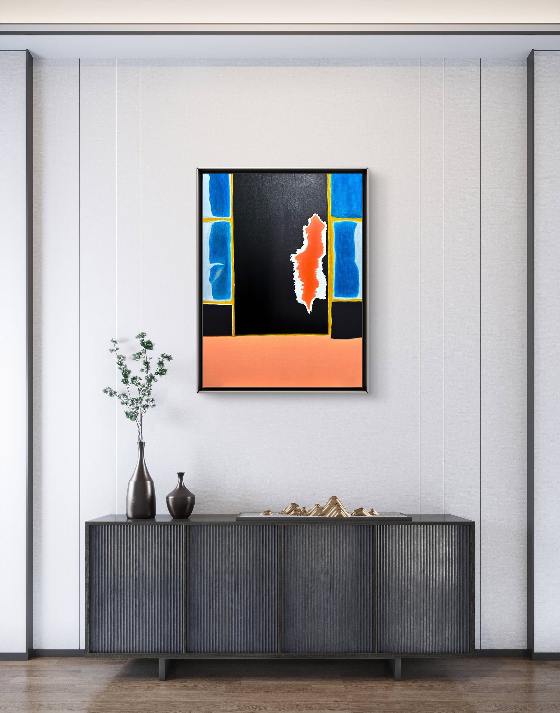 Abstract painting on a wall above a black cabinet with decorative items.